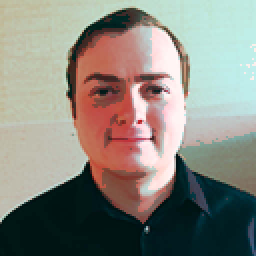 A male hitman dressed in unassuming fashionable clothing standing in a quiet coffee shop observing a day-dreaming female barista who is leaning over the counter and reading an erotic novel