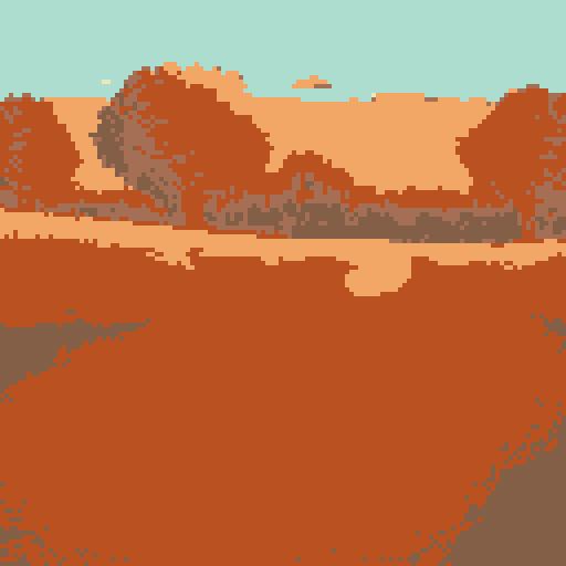 An autumn field glows orange in the sunset