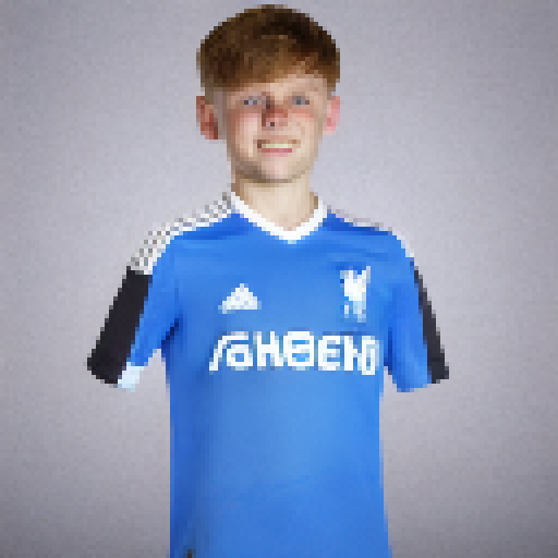 A boy with short light brown hair, blue eyes Liverpool football kit 